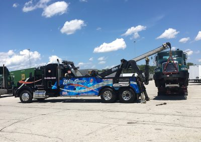 Wes's Towing a Green Truck lifted