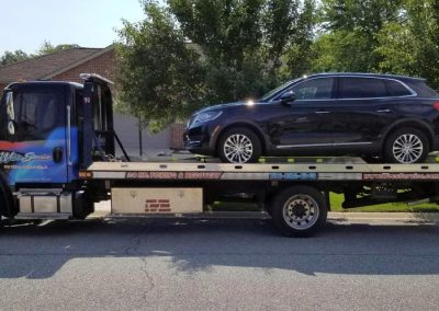 Flatbed Towing an SUV